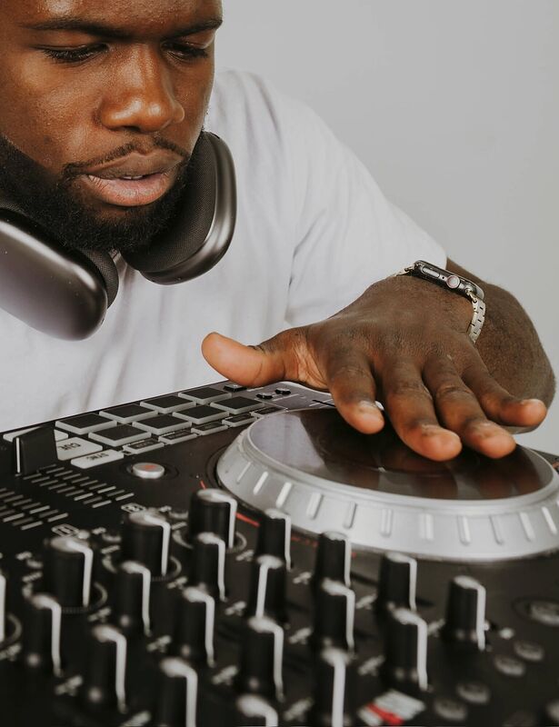 Close-up of hands on a DJ mixer