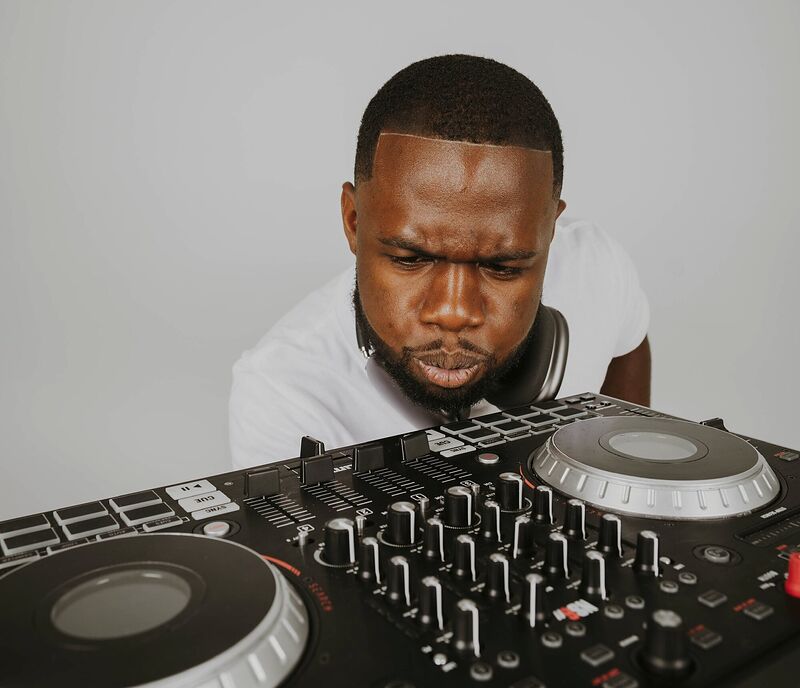 A DJ concentrating over a controller